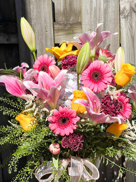Pink stargazer lily and white peonies centerpiece